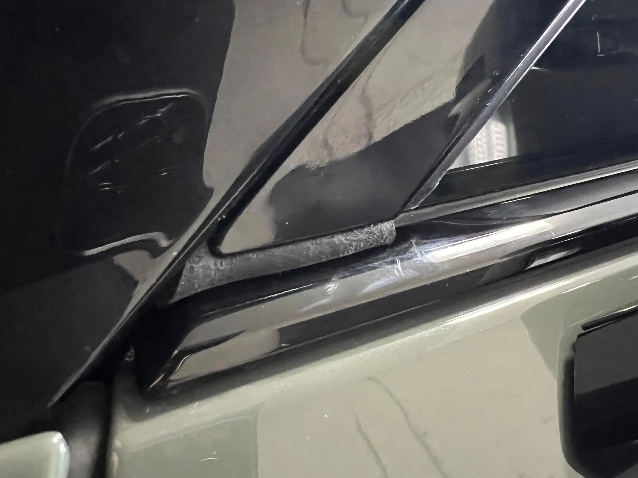 Rivian R1T R1S Resolved (my) excessive wind noise 2023 R1T (cause: corner window plastic trim) IMG_2133