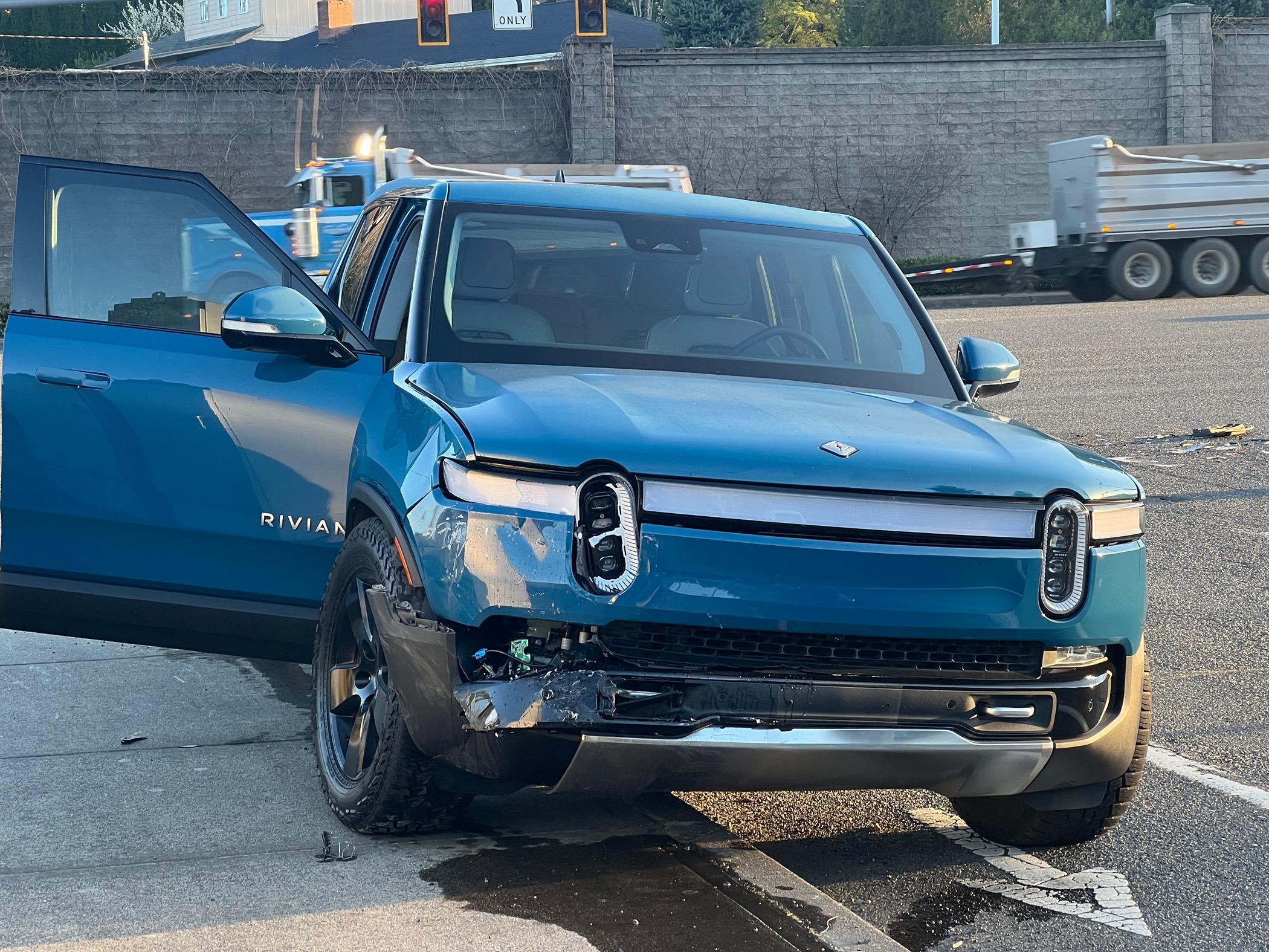Rivian R1T R1S Well, guess it was my turn.  Hit by a red light runner. IMG_3326