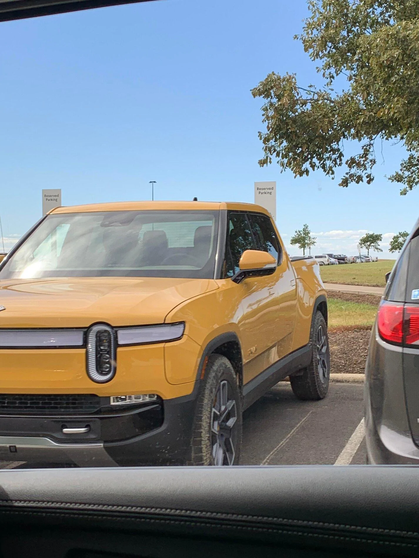 Rivian R1T R1S COMPASS YELLOW R1T Photos Compass Yellow 2022 Rivian R1T pickup truck 2