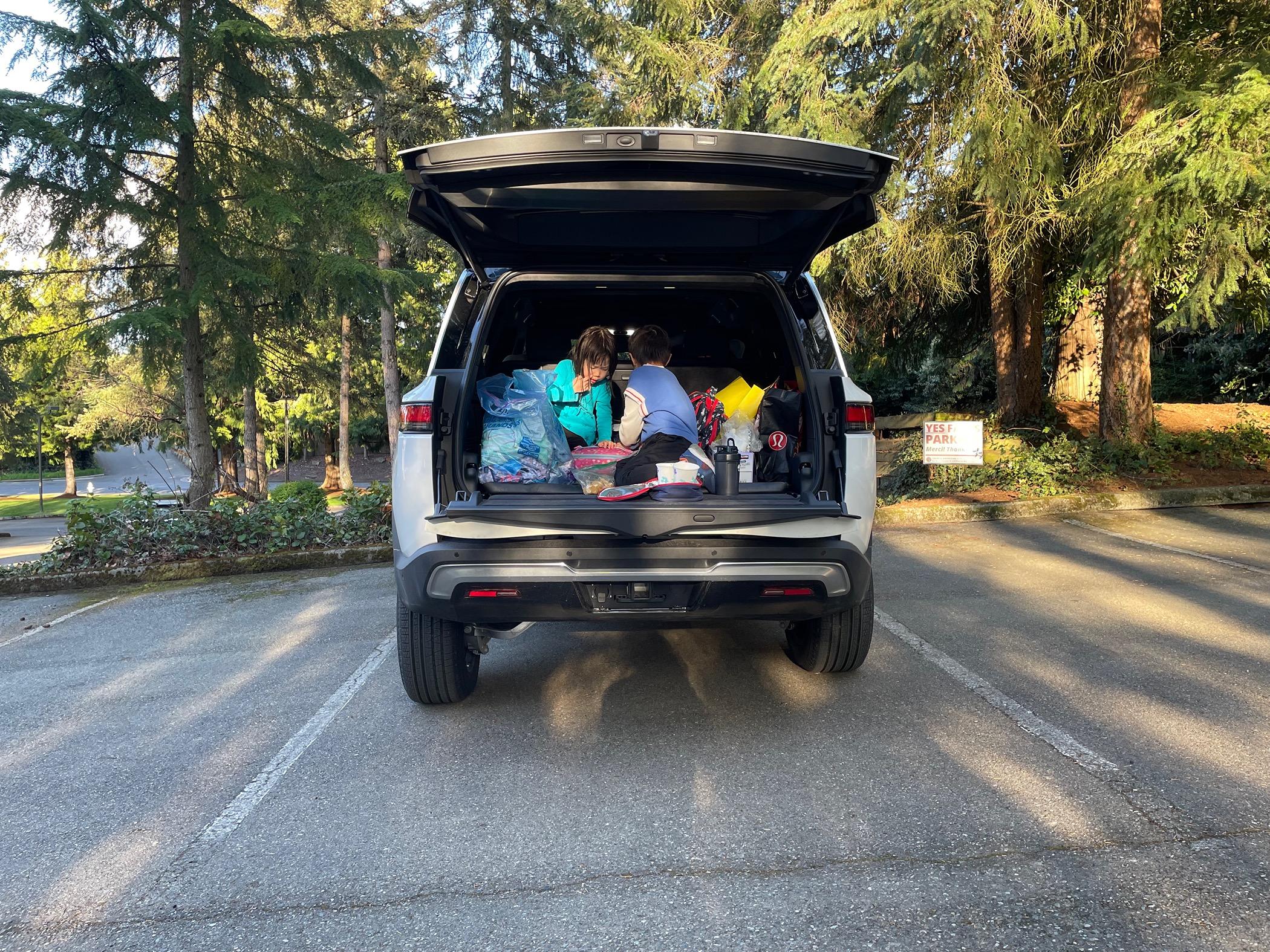 Rivian R1T R1S Camping mode auto leveling in parking lot - fun snack time IMG_7416