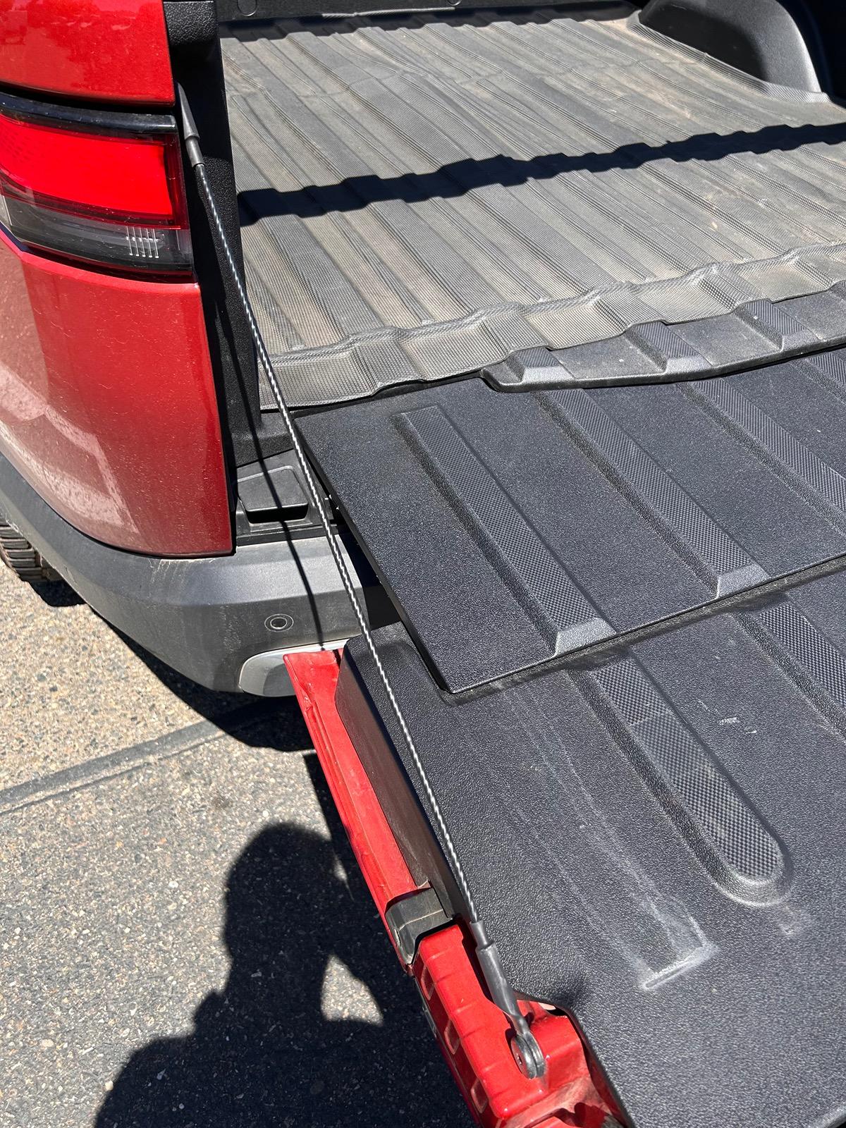 Rivian R1T R1S Are these tailgate straps doing anything? IMG_6650