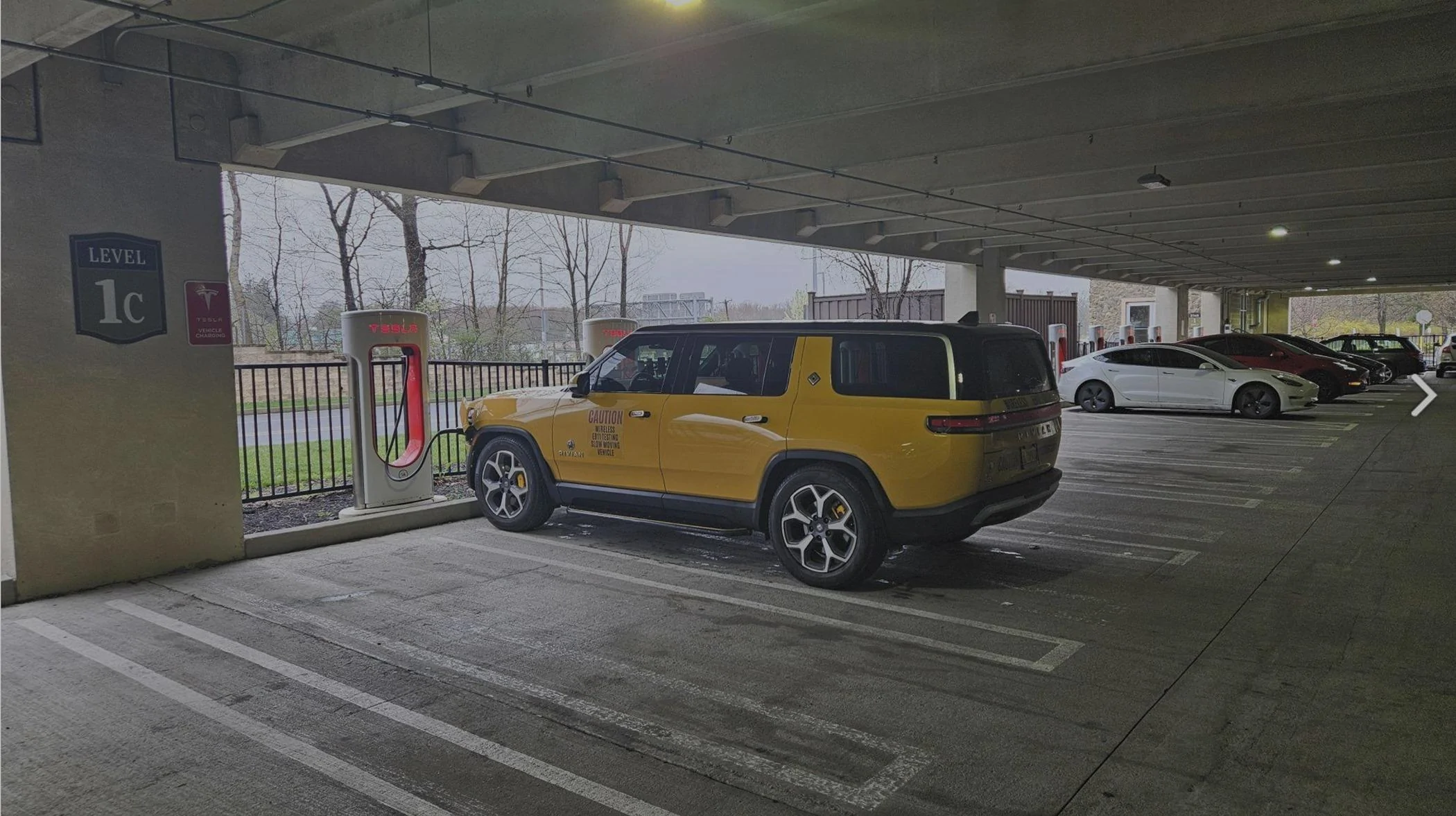 Rivian R1T R1S Strategic ways not to block two Tesla stations 2024-04-18 Tarkus at Tesla NACS SC