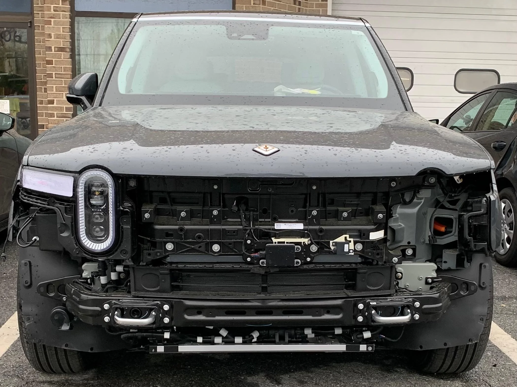 Rivian R1T R1S Does replacing a front door require disassembling front bumper, etc? IMG_2464