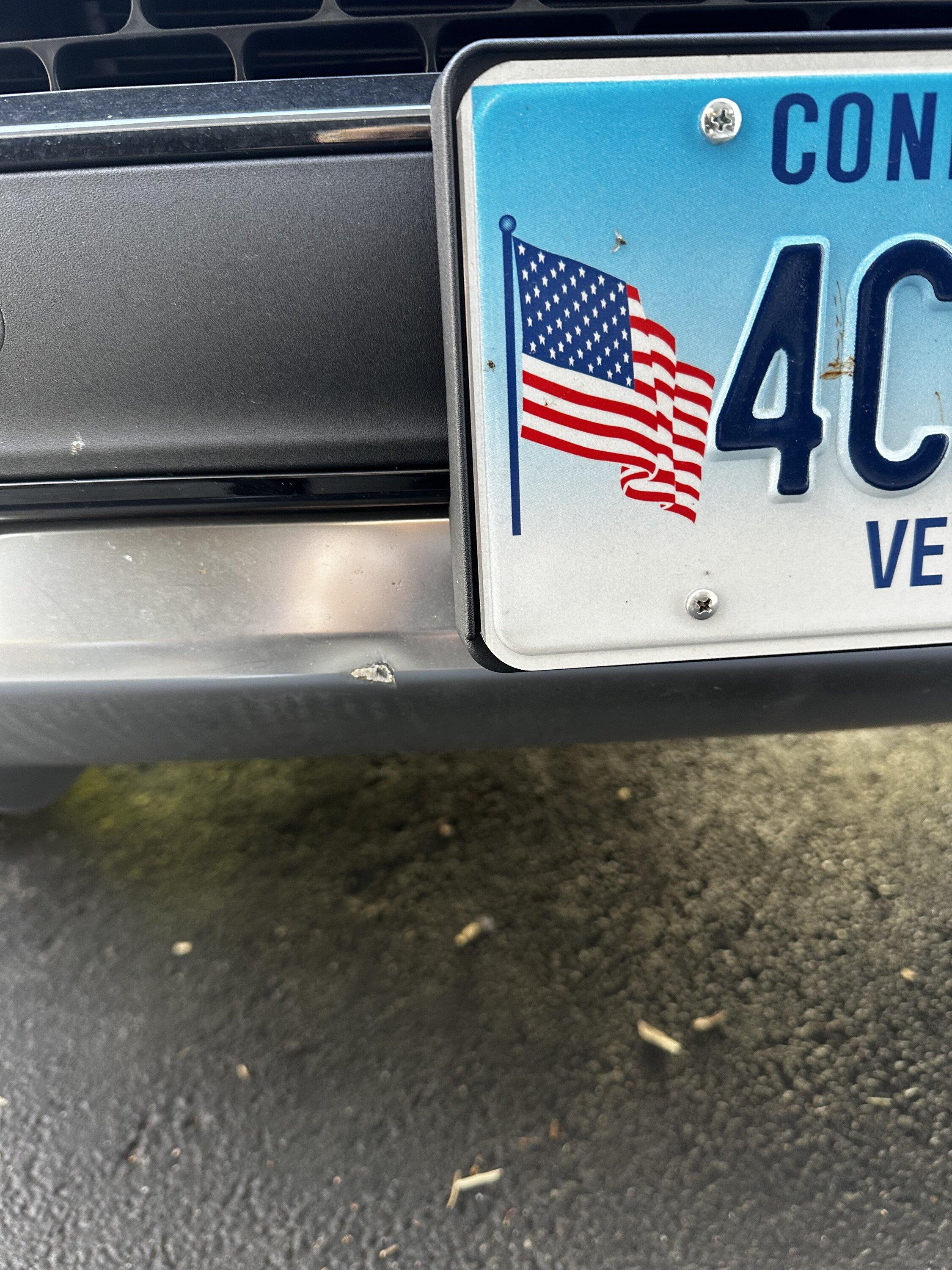 Rivian R1T R1S Rock ding on front grill IMG_0534