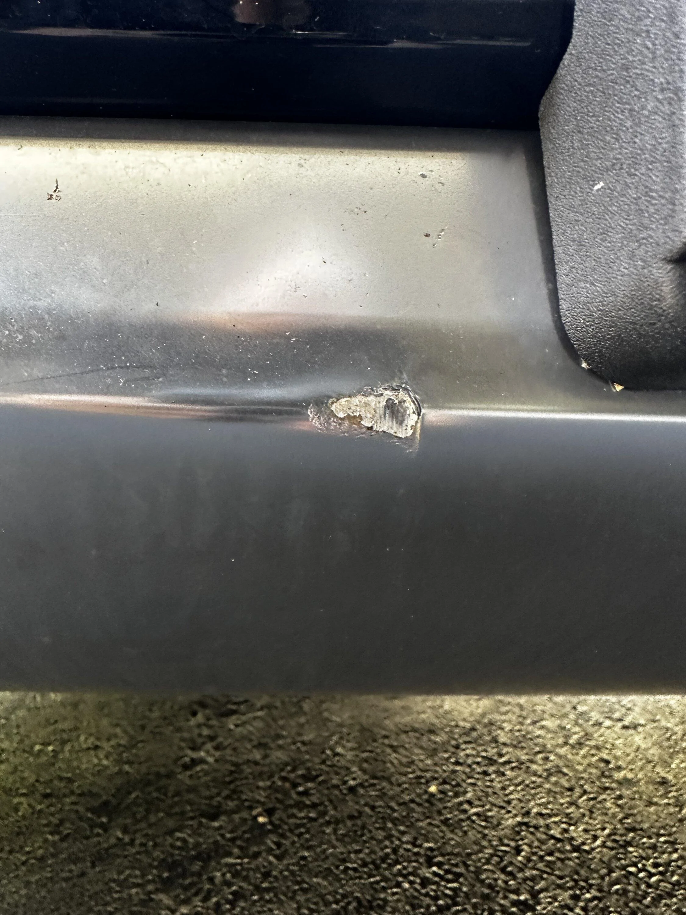 Rivian R1T R1S Rock ding on front grill IMG_0535
