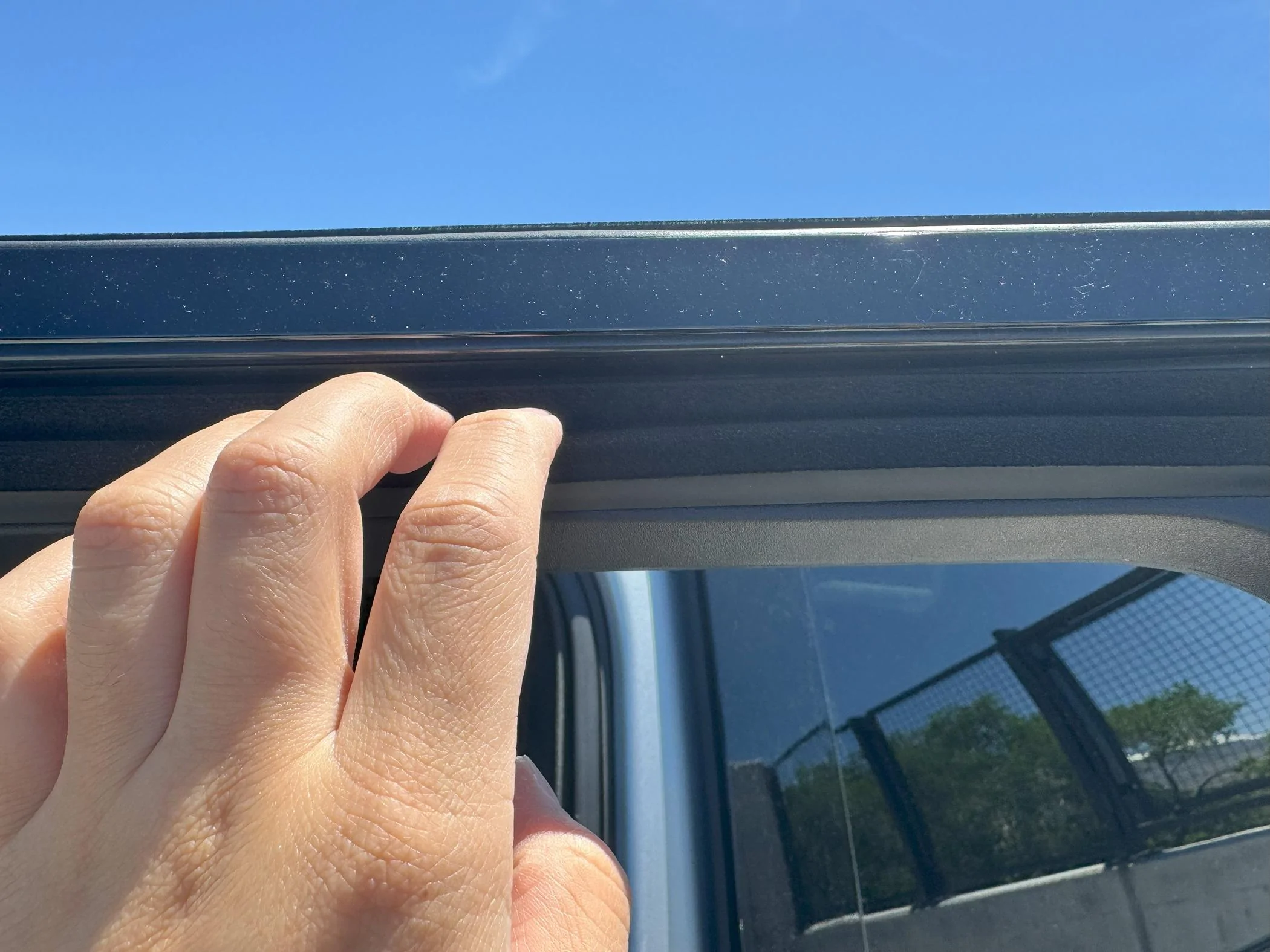 Rivian R1T R1S Guide: R1S / R1T Wind Noise FIX! inside window seal opening
