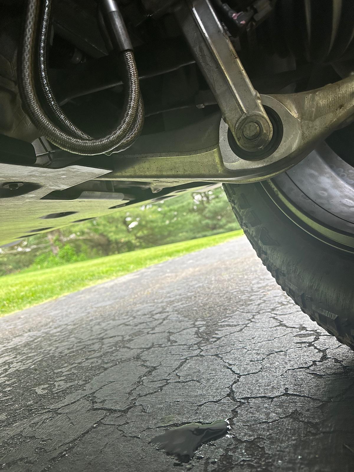 Rivian R1T R1S Fluid leaking from the shock absorber. IMG_3154