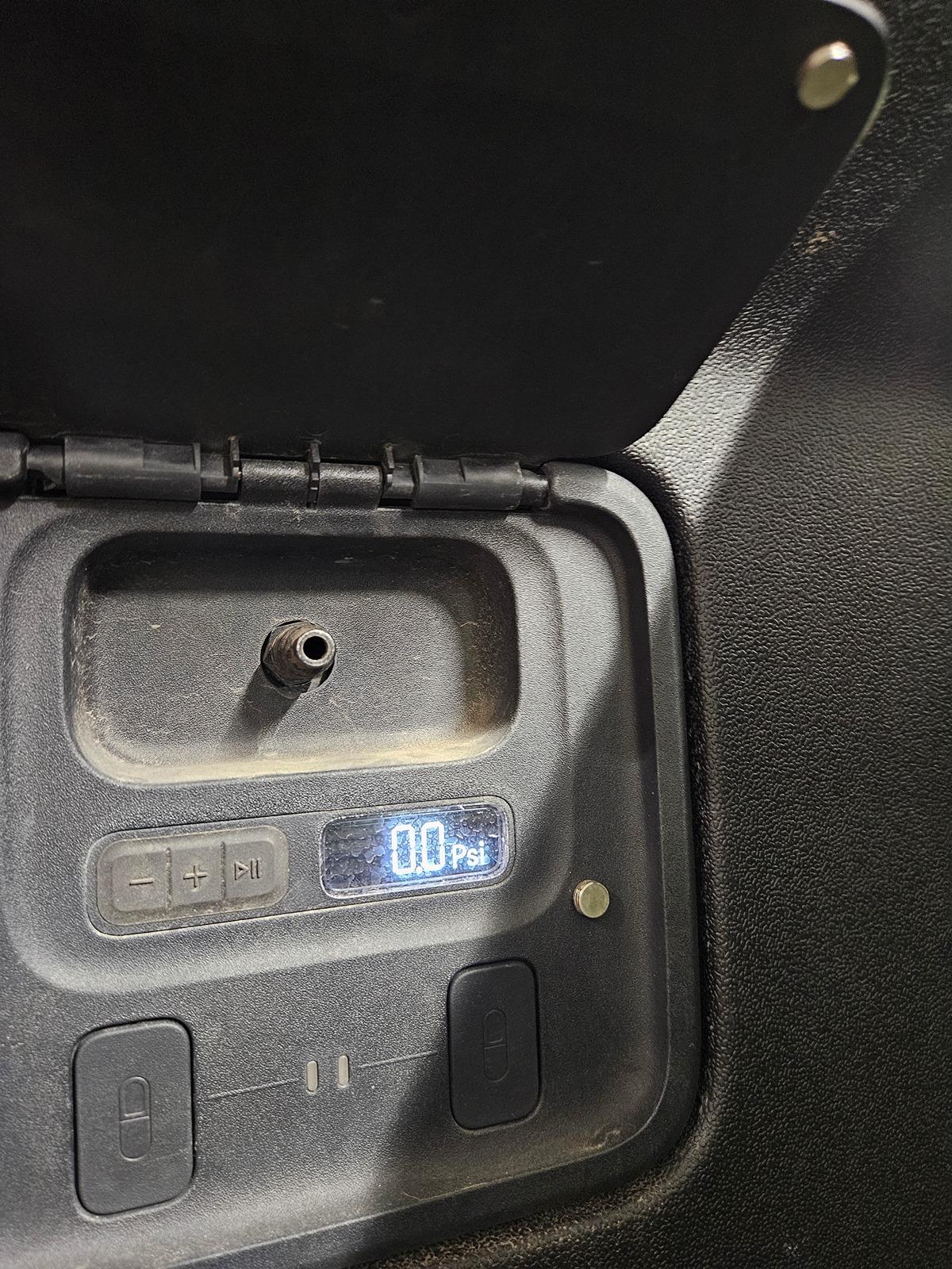 Rivian R1T R1S R1T cover flap on the air compressor 20240601_123859