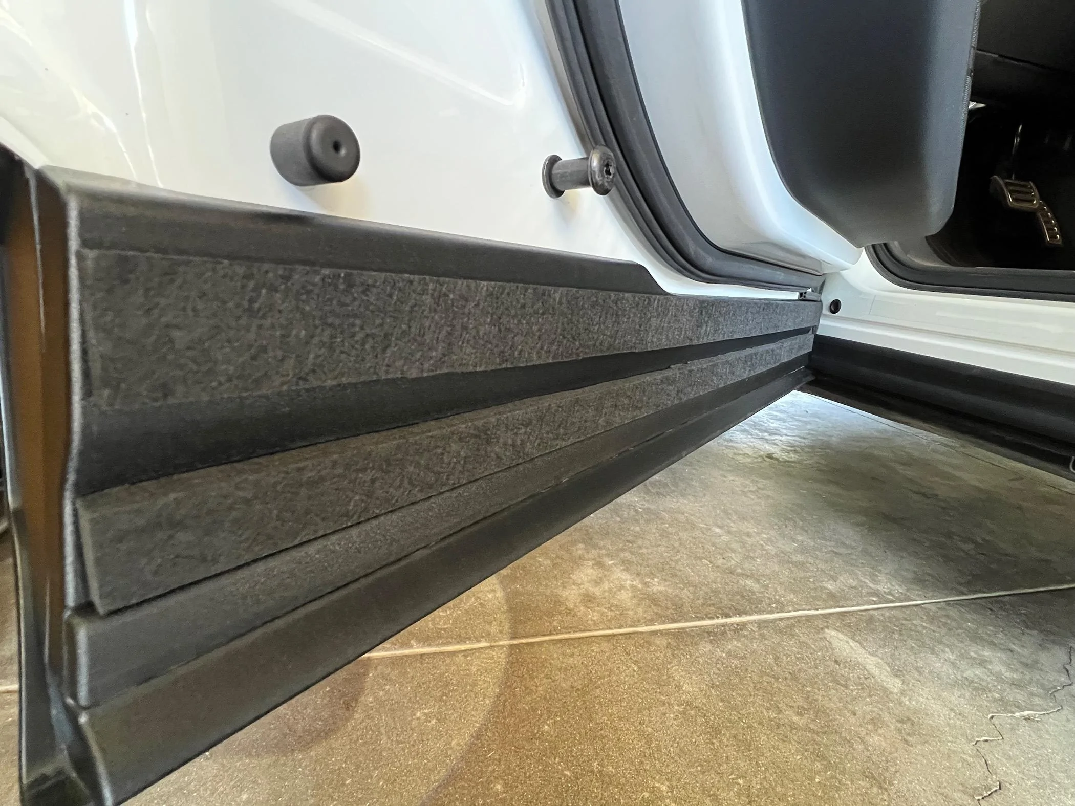 Rivian R1T R1S Road noise reduction measures - installed sound absorbing materials at doors IMG_8177