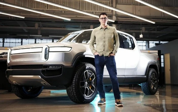 Article: Rivian’s CEO created buzzy, outdoorsy EVs. Now big automakers are coming after it
