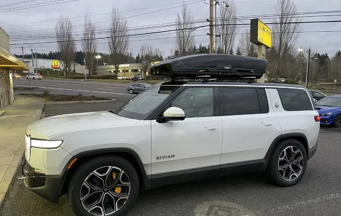 Rivian R1S gets Thule Motion XT XXl Roof Box installed