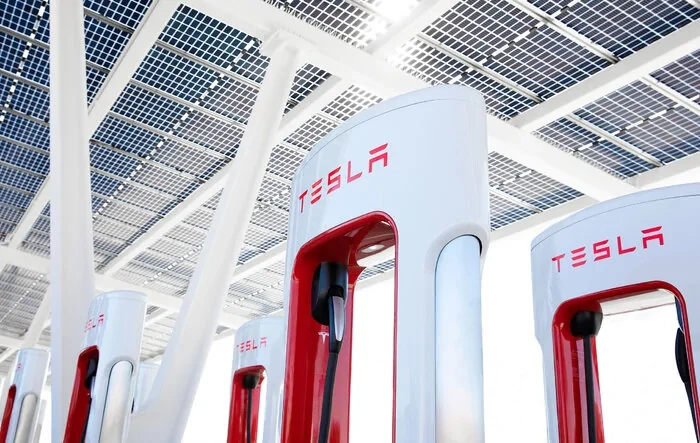 Tesla to open 20% of US Superchargers to all EVs by end of 2024, qualifying company for share of billions in federal dollars