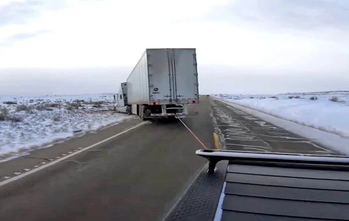 R1T pulling semi (38,000 lbs) stuck in snow