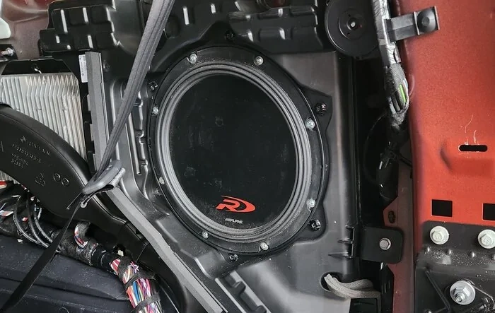 Upgraded the sub in R1S with aftermarket Alpine SWR-T10 Subwoofer