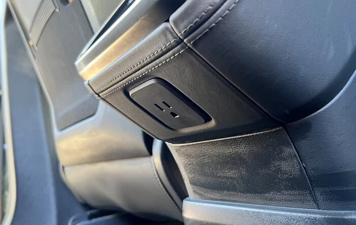 110V outlet inside the cab (under rear HVAC control screen)!