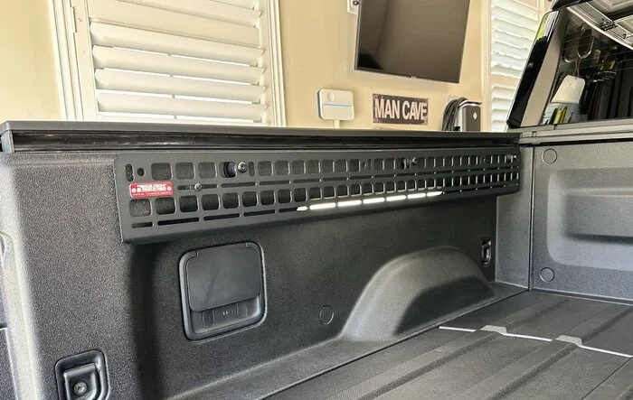 Builtright Bedside Molle Panel Kit installed in R1T bed