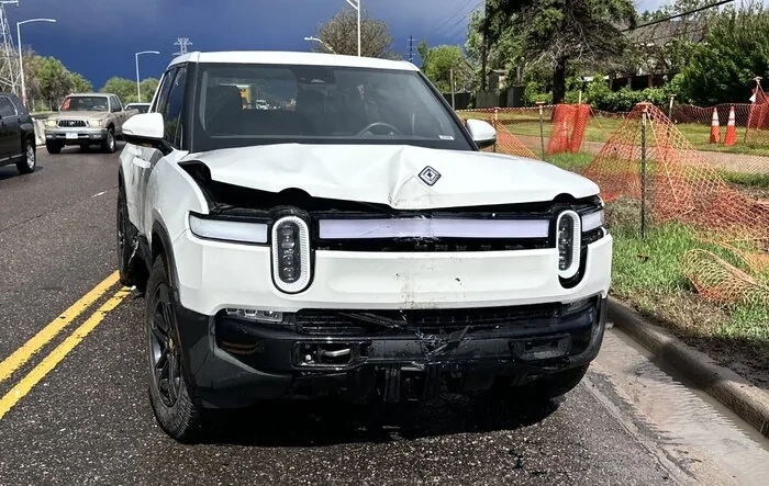 R1T t-boned. Let’s see what it costs to repair hitting a light pole
