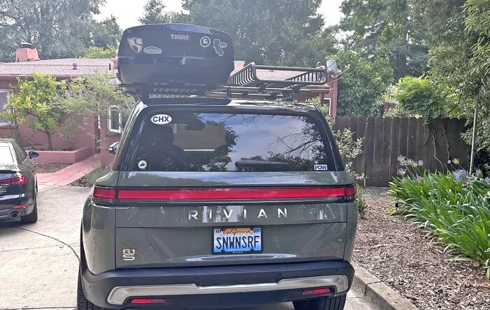 Thule roof rack, box and cage installed on R1S for road trip