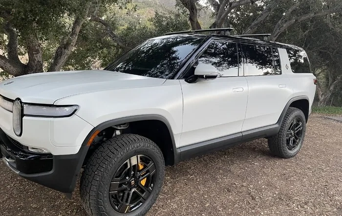 Rivian R1S (Glacier White) in Stealth Matte wrap, ceramic coating & ceramic tint, chrome delete, de-lettered