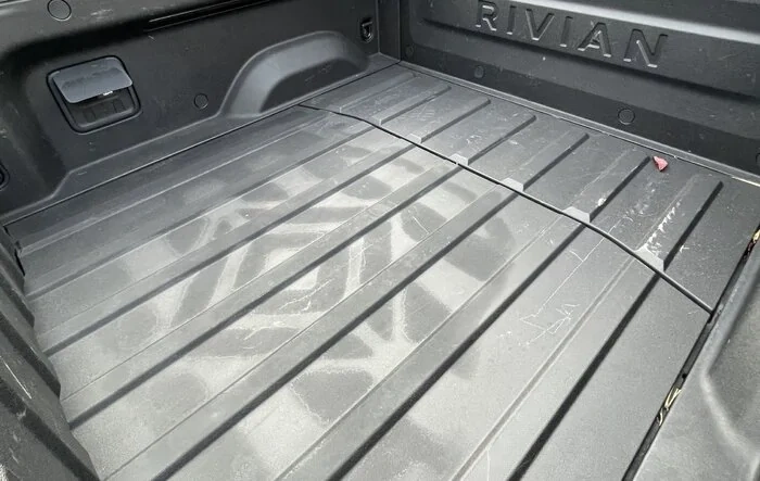 Feels like I found a secret decode (easter egg) -- Rivian symbol appeared on the bed floor