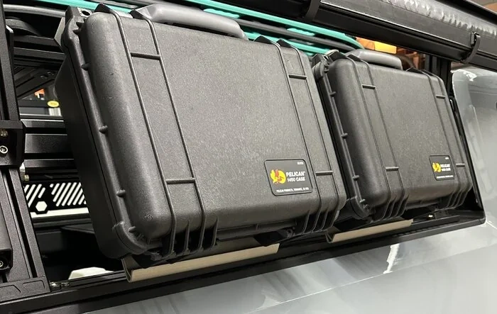 The Mounting Company's Pelican Boxes mounted on Xtrusion Overland Bed Rack