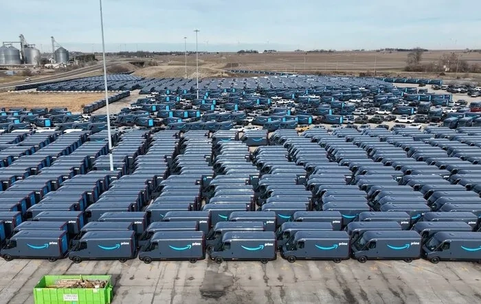 Tons of Amazon vans at factory. Drone view