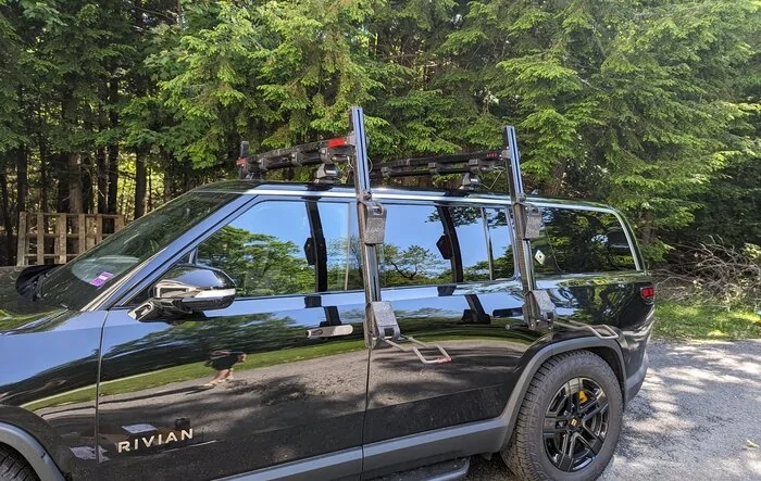 Dual Yakima ShowDown (Kayak And SUP Mount) on Thule Evo Rack on R1S