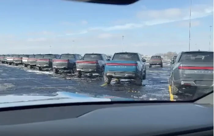 RJ Posts video of Rivian R1Ts waiting for delivery