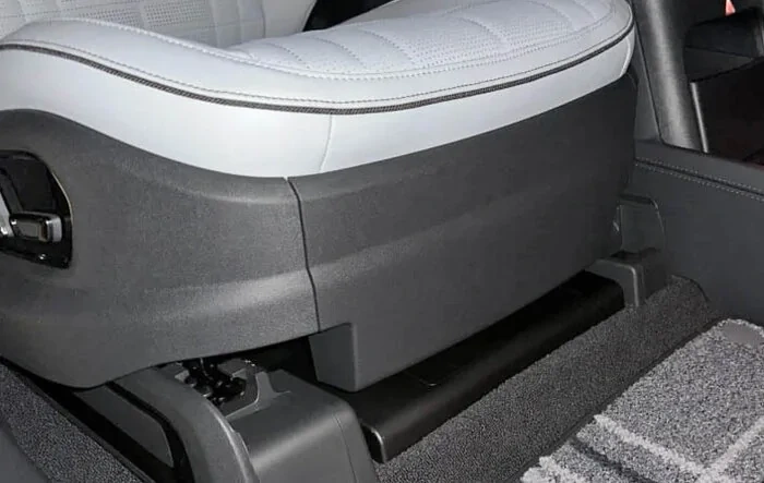 Under-seat front cubby gone from new builds