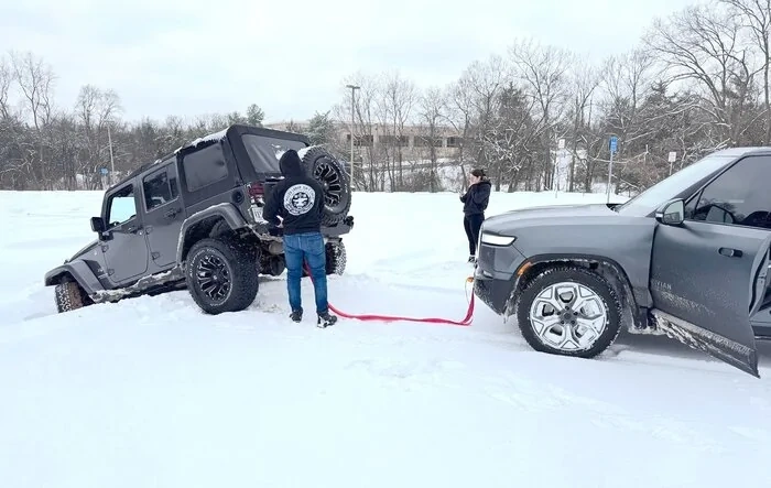 RIVIAN saves JEEP in over his head (literally)