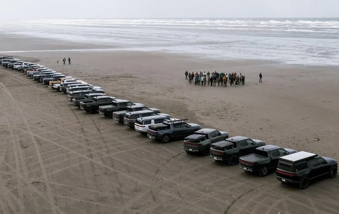 Happy Earth Day! 31 Rivians. Many friends and family and pets cleaning up two beaches! 5 truck loads!