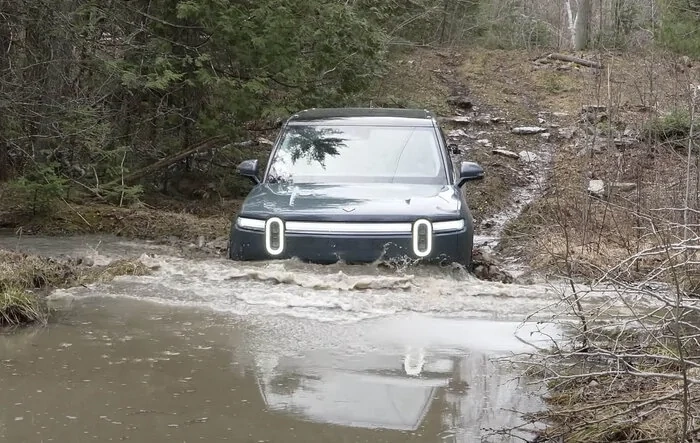 Can the Rivian R1S Make it Through THICK Mud/ Water? Video by Truck King