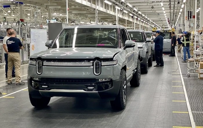 Inside Rivian’s EV plant and CEO RJ Scaringe’s strategy for growth, lower-priced EVs and competing with Tesla