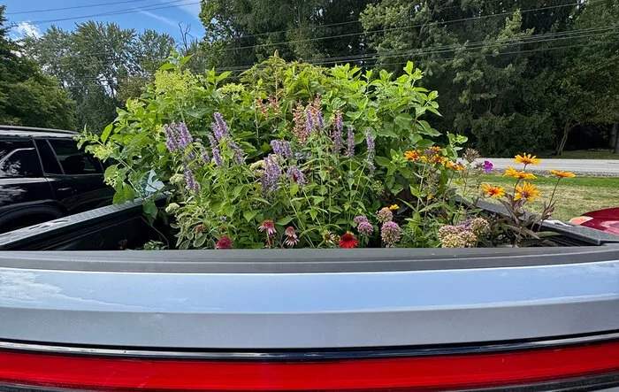 R1S owner gets a taste of R1T truck life and fills a bed with flowers. What's your first "truck stuff" moment?