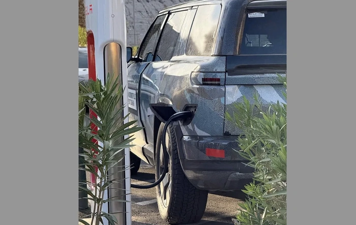 R2 spotted charging via NACS port at Tesla Supercharger