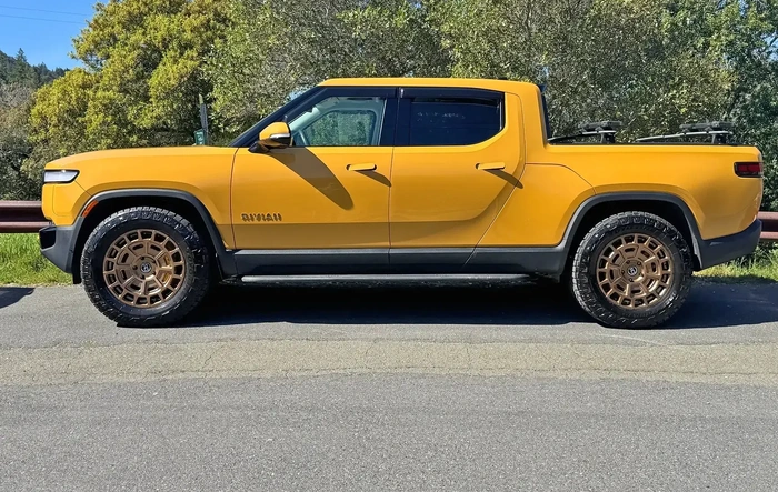 Toyo Open Country A/T III EV tires + Black Rhino Voltaic Bronze wheels on Compass Yellow R1T