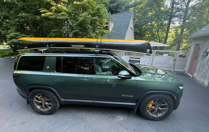 Hemlock Canoe Color-Matched to Rivian Yellow on My Forest Green R1S