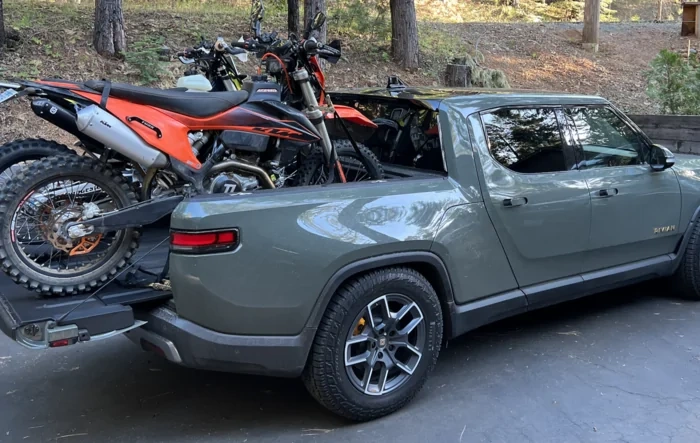 Rivian hauling dirt bikes in bed -- test fitting TE300 and 500 KTM
