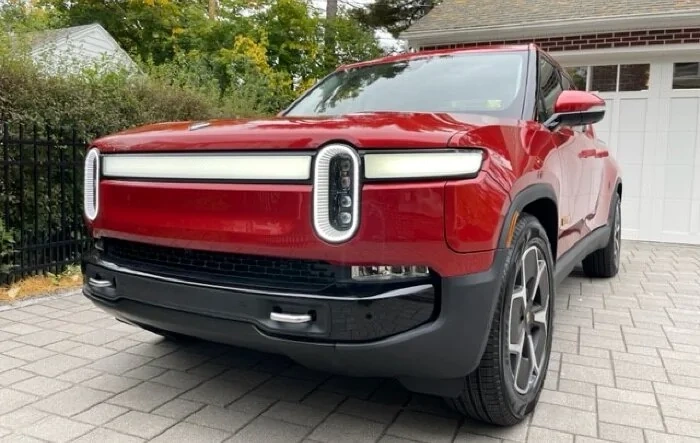Red Canyon / Ocean Coast R1T with XPEL OEM PPF, tailgate partial de-badge, and bumper vinyl wrap