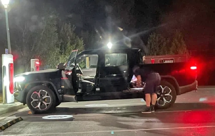 Rivian Spotted Charging at Tesla Supercharger?!