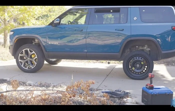 Rivian compact spare inflated & installed in glowing R1S review video [by Snazzy Labs]