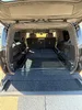 Rivian_R1S_Cargo_Liftgate_Open_Seats_Folded_03.webp
